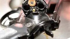 detail of revolver with one cartridge, real time