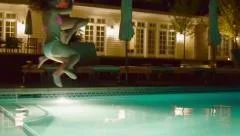 2 Teenage Girls Run And Jump Into A Pool At Night (Shot In Slow Motion)