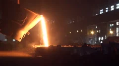 Iron and Steel Works. Pouring of molten iron.
