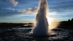 tourists watching Geysir geyser geothermal eruption Iceland close up