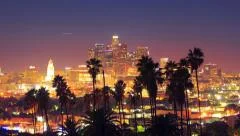 Downtown Los Angeles view palm trees in foreground. 4K UHD timelapse hyperlapse.