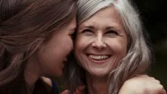 Close mother and daughter have a happy moment together