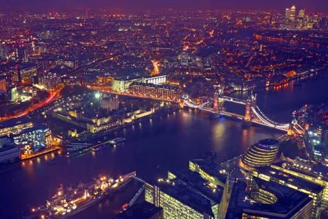 london  rooftop  view  panorama  at  sunset  with  urban  architectures  and  the  tower  bridge  with  thames  river  at  night xkwx aerial,  architecture,  attraction,  beautiful,  bridge,  britain,  british,  building,  city,  cityscape,  england,  english,  europe,  famous,  historic,  historical,  history,  kingdoms,  landmark,  old,  outdoors,  panorama,  panoramic,  river,  rooftop,  skyline,  street,  thames,  tower,  travel,  uk,  united,  urban