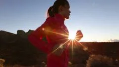 Asian woman runner running on mountain road - Female athlete training