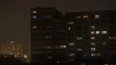 Communist apartment building on a foggy night - time lapse