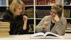 Two women at a library