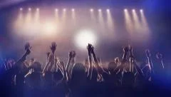 Crowd partying, dancing slow motion at a concert