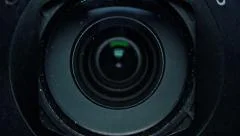 Zooming Camera Lens in a Digital Photo Camera. Full HD