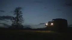 Military jeep turning to the forest