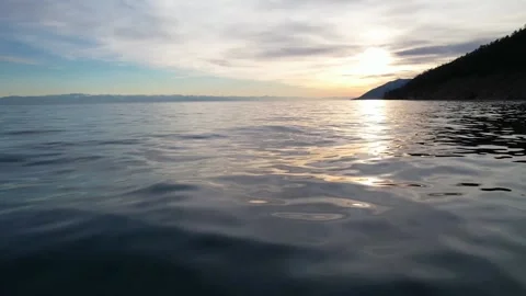 047 Small golden waves in the sunset. Closeup. Stock Footage 166573452