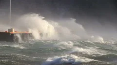 crashing waves against pier docks, heavy sea spray, hurricane gale force wind