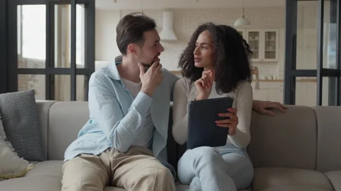 0486 Couple Discussing Tablet Content Together On Cozy Living Room Sofa 스톡 동영상 318929916