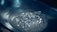 Drug heroin boiling, in spoon before addict