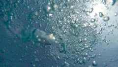 Bubbles Surfacing in Slow Motion from the Ocean Depth.