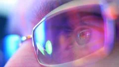 Reflection in the eye and glasses of the monitor when watching a movie