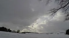 Time lapse; Thick clouds passing, landscape in snow