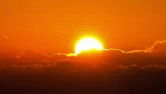 sunrise sun timelapse close up over horizon glowing clouds