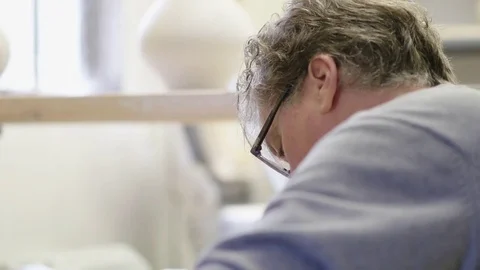 05 Ceramic Throwing - Potter Looking Down at Wheel Vidéo 77758497