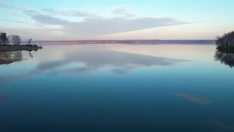 050 Sunset clouds reflect in the water Stock Footage 166573494