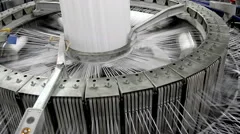 Textile industry - yarn spools on spinning machine in a factory
