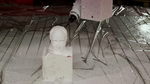 051 production of a 3d model of the head made of foam on a five-axis cnc mac Stock Footage 154897555