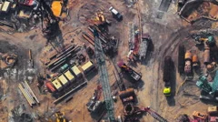 Time lapse video of construction activity. Cranes, trucks, workers and equipment