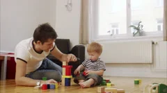 Father and son building a tower, Sweden.