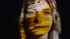 Close up shot of projections on stressed woman's face / Cedar Hills, Utah,