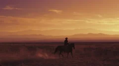 Slow motion shot of a cowboy riding a horse