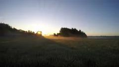 beautiful summer sunrise on farm field with morning mist fog. Timelapse 4K
