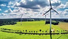 Aerial view of summer countryside with wind turbines