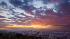 Beautiful sunrise over city of Los Angeles skyline. Zoom in. 4K UHD Timelapse.