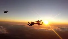 Skydive team work at the sunset