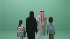 Arabic Adult Parents with two Children walking