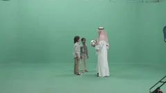 Arab Parent with children playing football