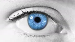 Zoom in from a blue human eye to a neuron cell animation. Gray skin.