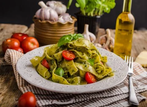 Pasta  with  basil  pesto,  very  simple  and  delicious.  Pesto  from  olive  oil,  basil,  nuts  and  parmasan xkwx pasta,  pesto,  food,  basil,  sauce,  italian,  green,  spaghetti,  plate,  healthy,  spinach,  tagliatelle,  white,  dish,  cheese,  cuisine,  meal,  cooking,  herb,  tasty,  traditional,  italy,  gourmet,  dinner,  lunch,  restaurant,  oil,  parmesan,  fresh,  background,  eating,  leaf,  fettuccine,  homemade,  diet,  garlic,  vegetarian,  closeup,  vegetable,  photography,  mediterranean,  parmesan,  parmasan,  milan  pesto,  olive  oil,  bio,  organic,  domestic,  wood,  napkin
