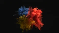Colorful powder/particles fly after being exploded.  4K 30fps. Slow Motion.