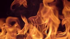 Closeup of fire burning on black background in slow motion; shot on Phantom Flex