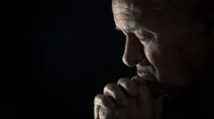 sad old man praying in the darkness: sad old man, depressed old man, praying