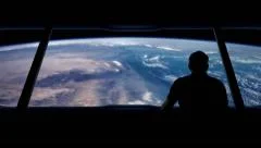 Astronaut Looks Out At Earth From Orbit