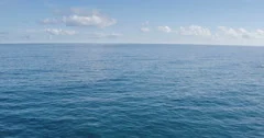 4K Flying Low Over Ocean Revealing Sea Cliffs. Aerial Shot.