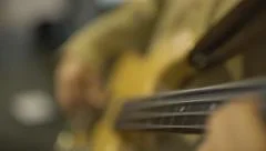 Playing on a guitar close up 4K