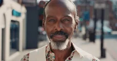 Slow Motion Portrait of happy mature african american man smiling