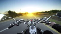 A motorcycle road adventure going forward to the sun in high speed. pov at su
