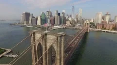 Aerial shot of Brooklyn Bridge. Camera moving slowly towards Manhattan.
