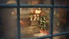 Christmas tree scene through frozen window frame