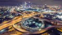 Aerial view freeway interchange downtown Los Angeles skyline night 4K timelapse