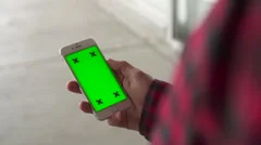 Close Up Man Holding Vertical Iphone with Green Screen For Custom Content