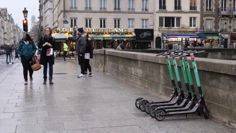 06 Rainy gray winter day Paris young people girls tourists enjoy walking Stock Footage 100814734
